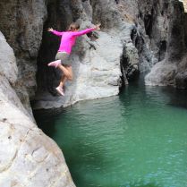 A daring tourist, Georgie, takes a dive into the blue waters of Somoto Canyon!